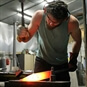 man forging sword